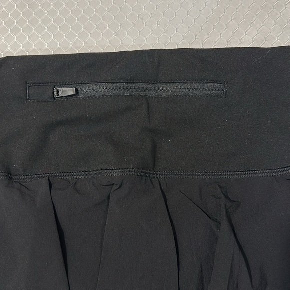 Black skirt with shorts underneath, side cell pockets in shorts, drawstring band - Picture 7 of 7